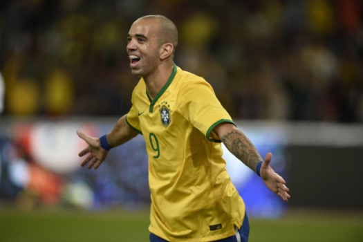Diego Tardelli mais uma vítima dos bandidos do futebol. – Foto: (Foto: FRED DUFOUR / AFP)