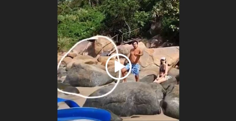 Foto mostra print do vídeo com o homem no fundo e um círculo onde a pedra foi escrita