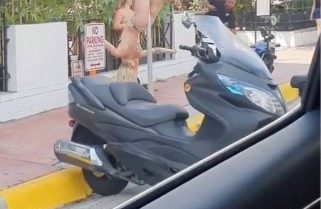 Mulher viraliza em v&iacute;deo, ap&oacute;s dan&ccedil;ar de biquini em placa de tr&acirc;nsito – Foto: Internet/Reprodu&ccedil;&atilde;o/ND