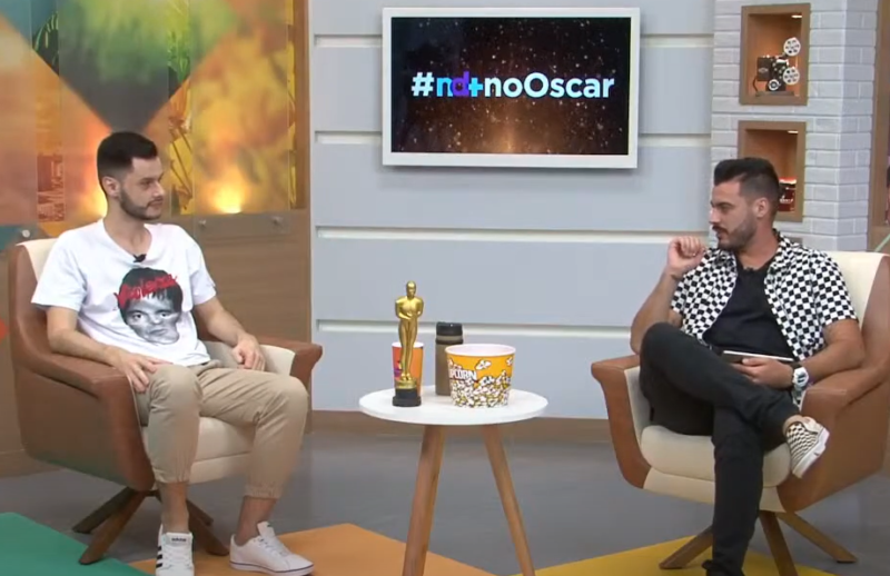 Mikael Melo, apresentador da live, ao lado de Alfa Stofelli, comentarista da transmissão