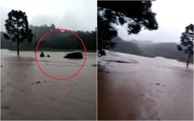 pessoas ilhadas em rodovia após chuva
