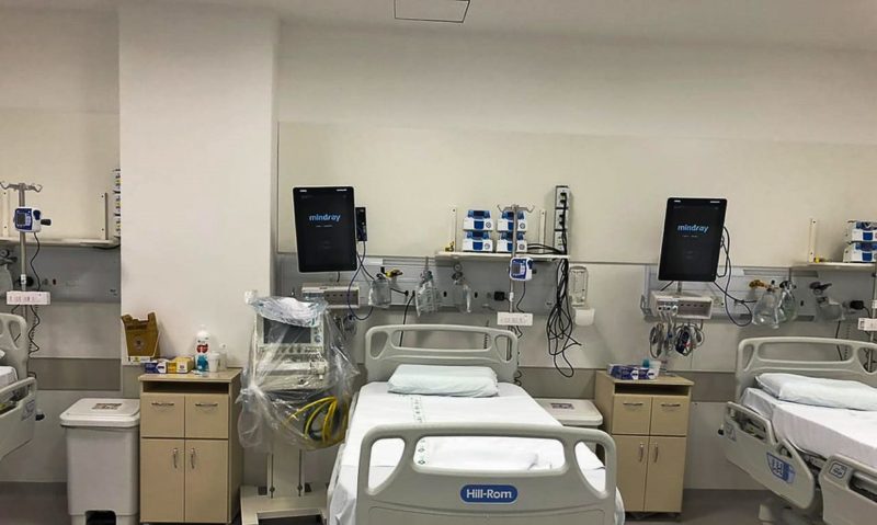 The image shows an empty bed in the intensive care unit. 
