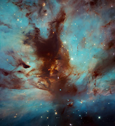 The Flame Nebula, also called NGC 2024, is a region of intense star formation about 1,400 light-years from Earth.  The image shows the dark and dusty heart of the nebula, located in the constellation of Orion, in which numerous stars are present - Photo: Reproduction / NASA / ESA