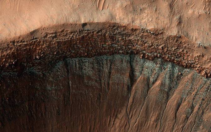 Recorded in winter in the planet's southern hemisphere, this crater on Mars is filled with carbon dioxide we know as 