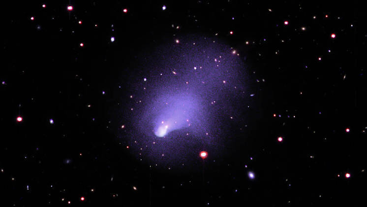 After a lengthy analysis by NASA's Chandra X-ray Observatory, an image showing a pair of galaxy clusters believed to be one of the largest structures in the universe has come to light.  This cluster, which contains hundreds of galaxies and huge amounts of hot gas and dark matter, is located about 2.8 billion light-years from Earth.