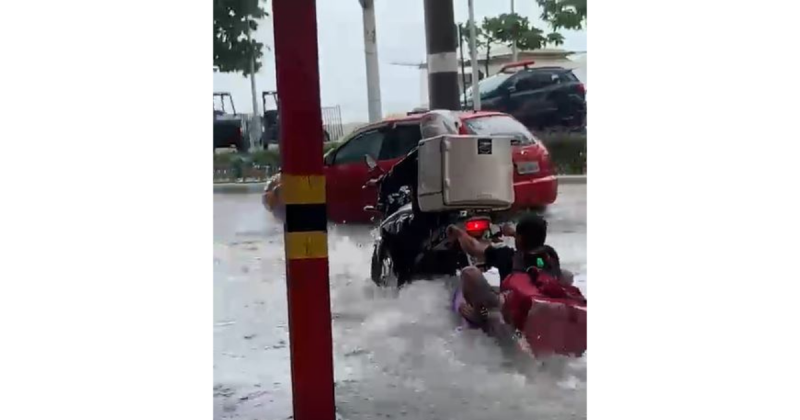 Homem aparece usando prancha de bodyboard para “surfar” nas ruas de Balne&aacute;rio Cambori&uacute; – Foto: Reprodu&ccedil;&atilde;o/ND