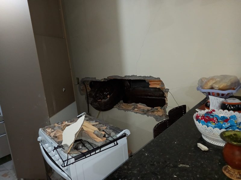 the driver crashed the car and broke the kitchen wall