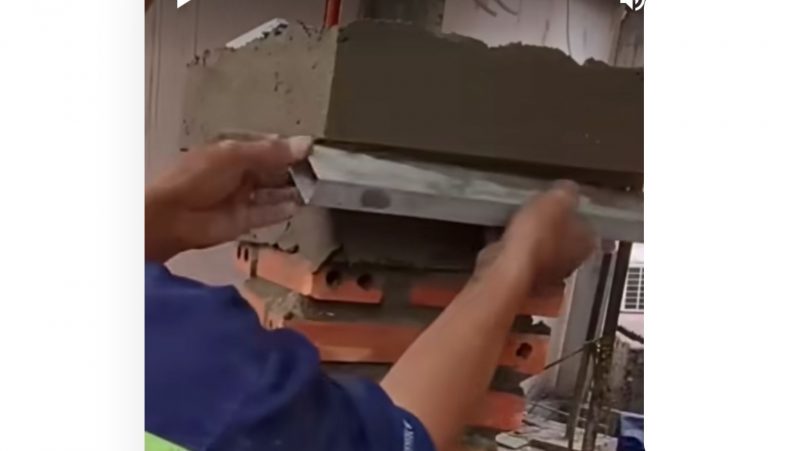 Pedreiro passa a régua com cuidado para não perder qualidade