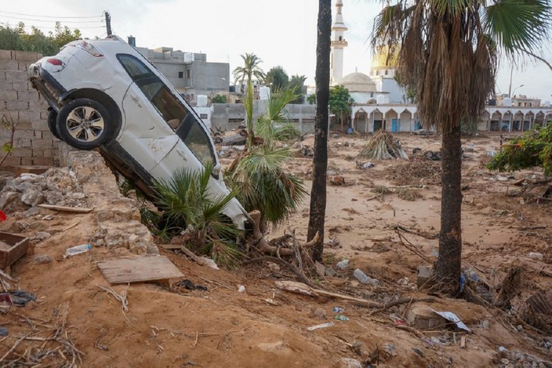 Cars are covered in mud and debris after devastating flooding in the eastern Libyan city of Derna.