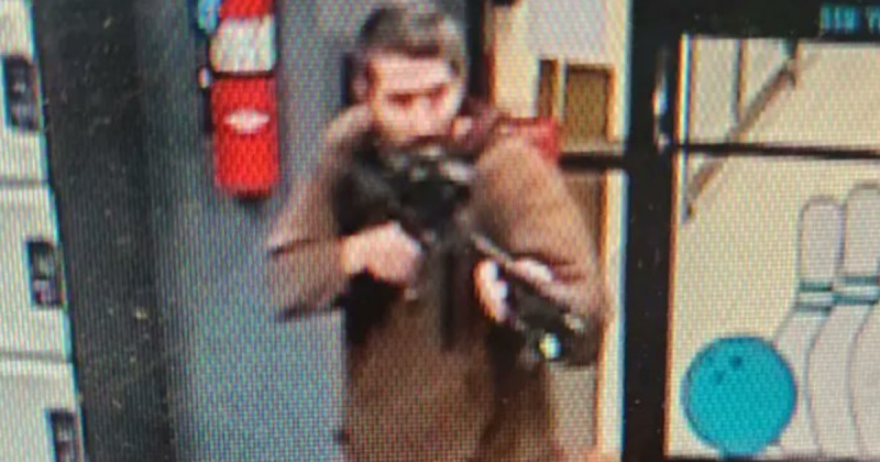 A man with a beard and a gun, identified as Robert Card, 40, gunman suspected of killing 18 people in a shooting in Maine