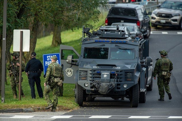 Armored vehicles are also helping police teams searching for the shooter - Joseph Prezioso/AFP