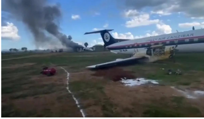 The plane crashed into mud and grass.  The photo shows smoke coming from the tail of the plane to illustrate an article about plane crashes.