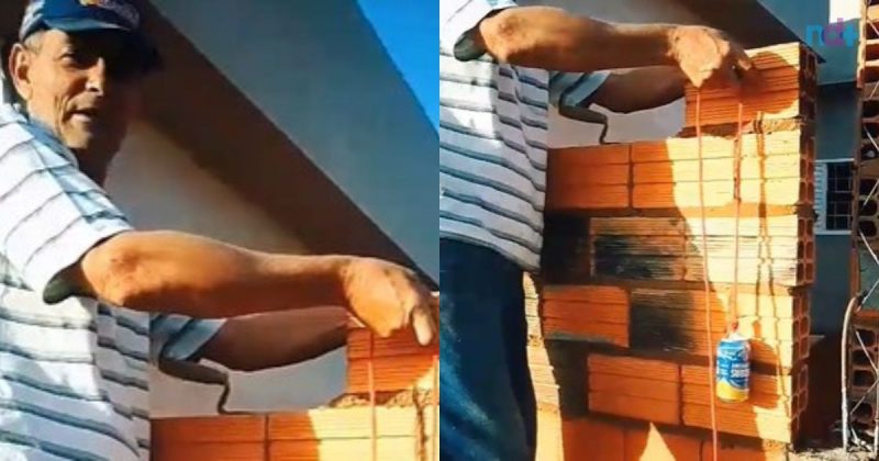 Pedreiro constrói parede com suporte para cerveja