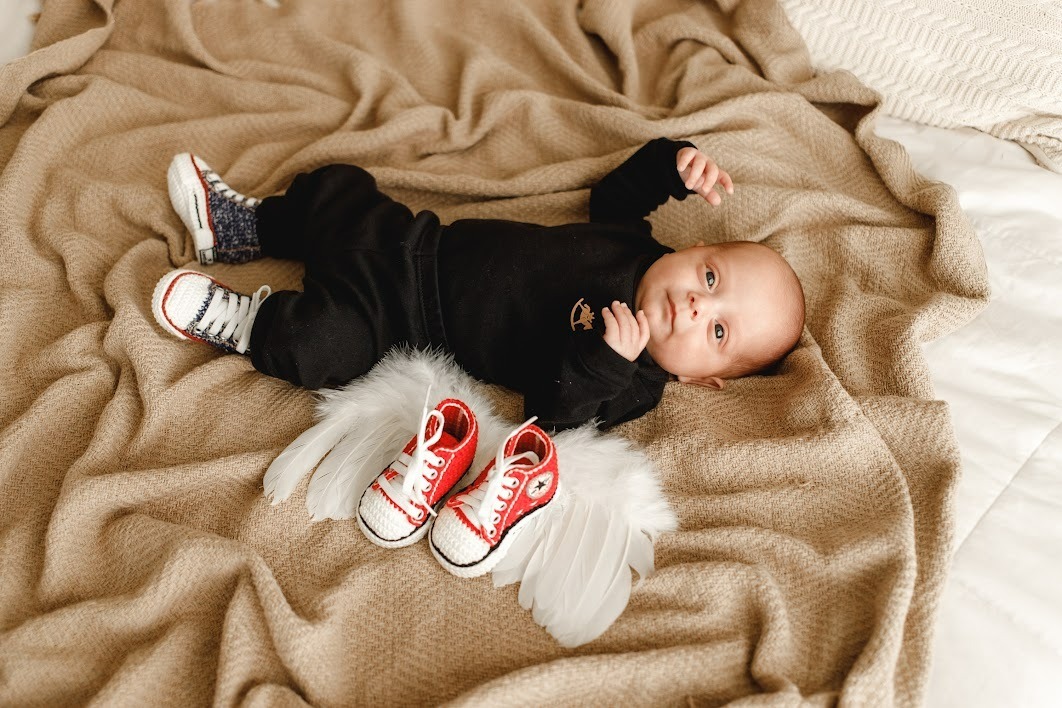 Photoshoot of Miguel as a “newborn” next to his little sister’s shoes – Personal Collection/Disclosure