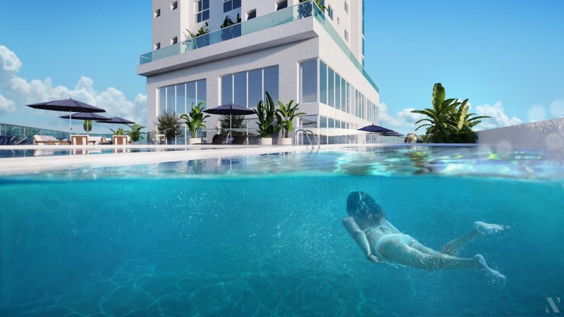 Skyscraper in Balneario Camboriu with a swimming pool where a woman swims