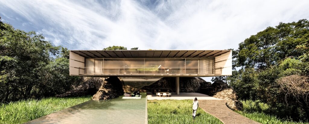 Facing the bridge and the sunset, the house is integrated with nature and has bold solutions for sun protection.  -Igor Macedo/ND