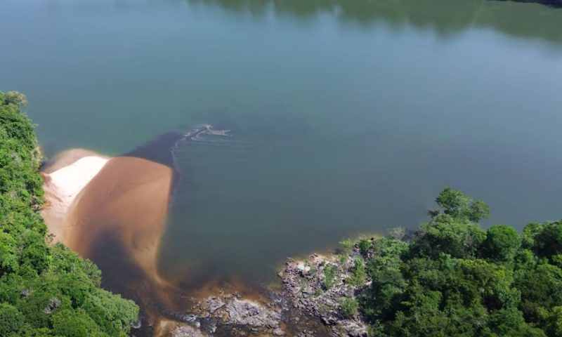 A fisherman uses a drone to photograph the confluence of the Buyusu and Aripuana rivers.