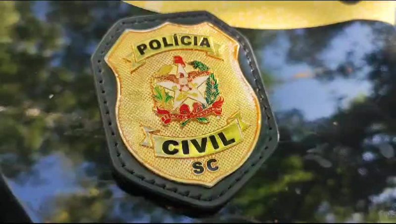 Badge of civilian police investigating financial fraud.