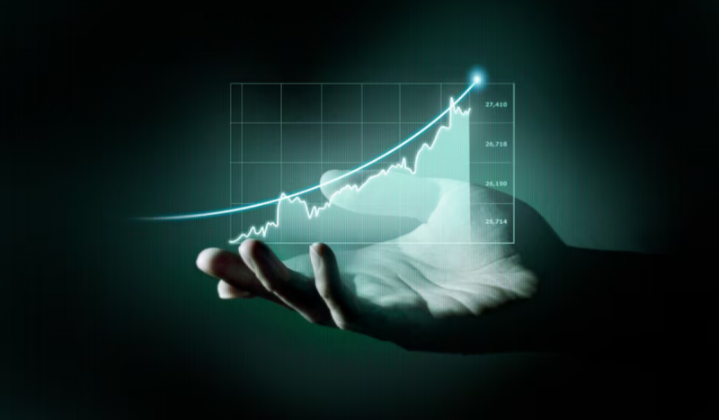 Bilionários - Imagem mostra índice subindo em gráfico holográfico, foto tem filtro predominantemente azul