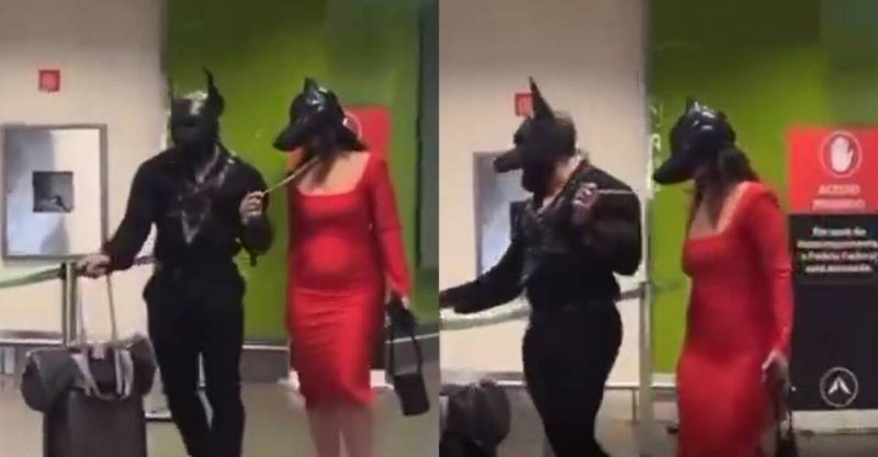 casal com mascara de cachorro no aeroporto