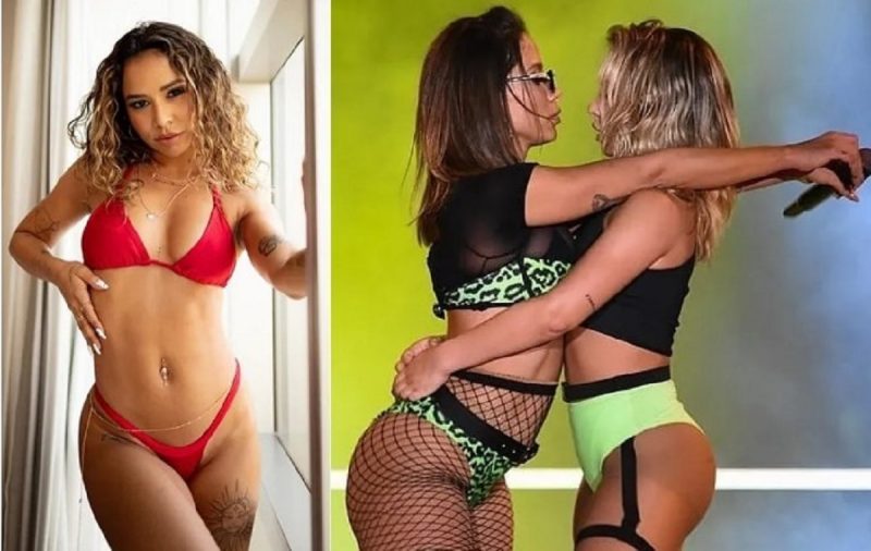 na foto aparecem a bailarina de Anitta abraçada com a patroa durante show