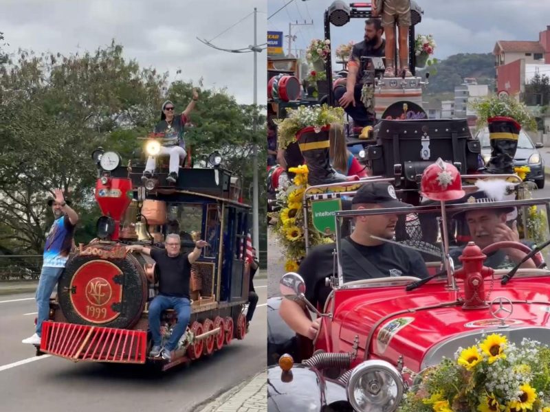 A imagem mostra carros enfeitados em um desfile na rua.