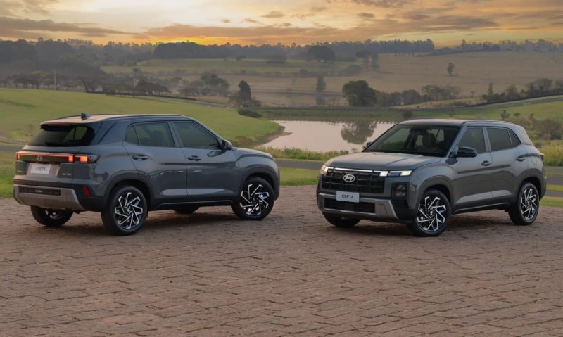 2 Hyundai Creta de frente um para o outro e com uma paisagem bucólica, com muito verde e um lago ao fundo