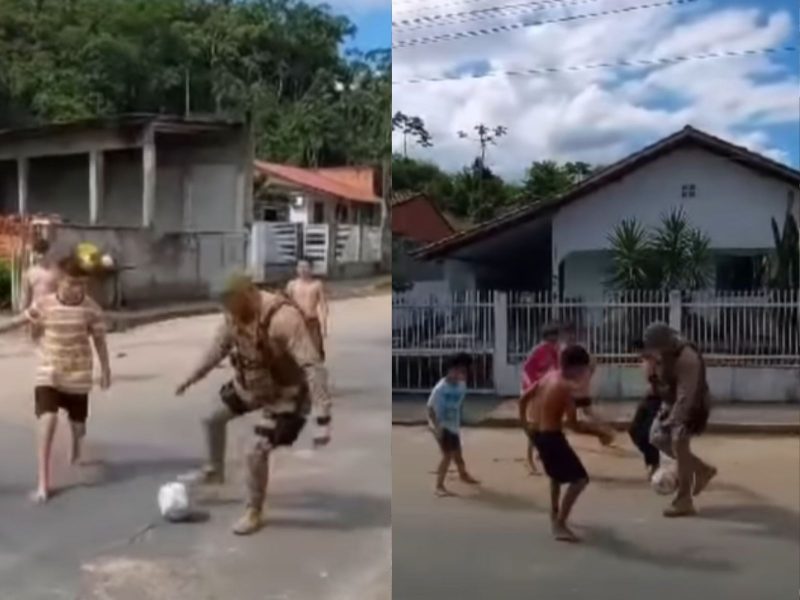 A imagem mostra um policial militar que parou a patrulha por um instante para jogar futebol com as crianças na rua 