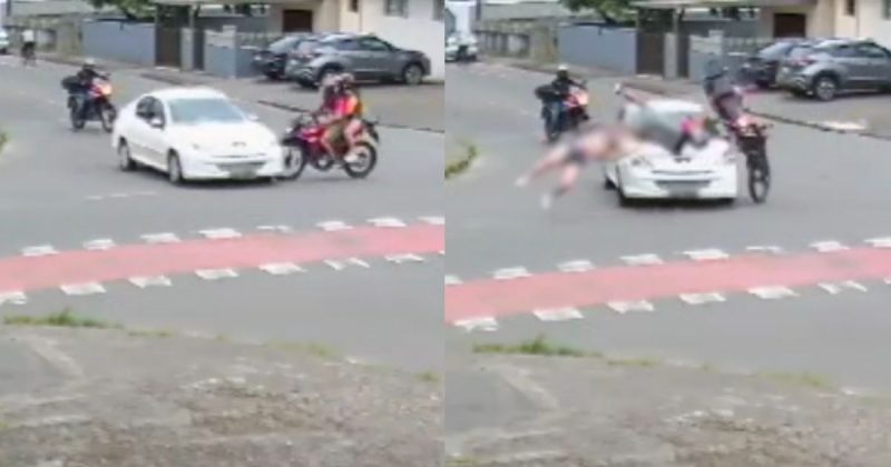 Momento em que carro fura preferencial e casal em moto 'voa' em rua de Joinville (SC)