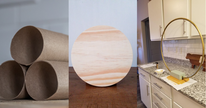 Materiais de artesanato Imagem de rolos de papel, um aro d emadeira e uma tábua de madeira, para fazer referência aos materiais que serão utilizados na decoração