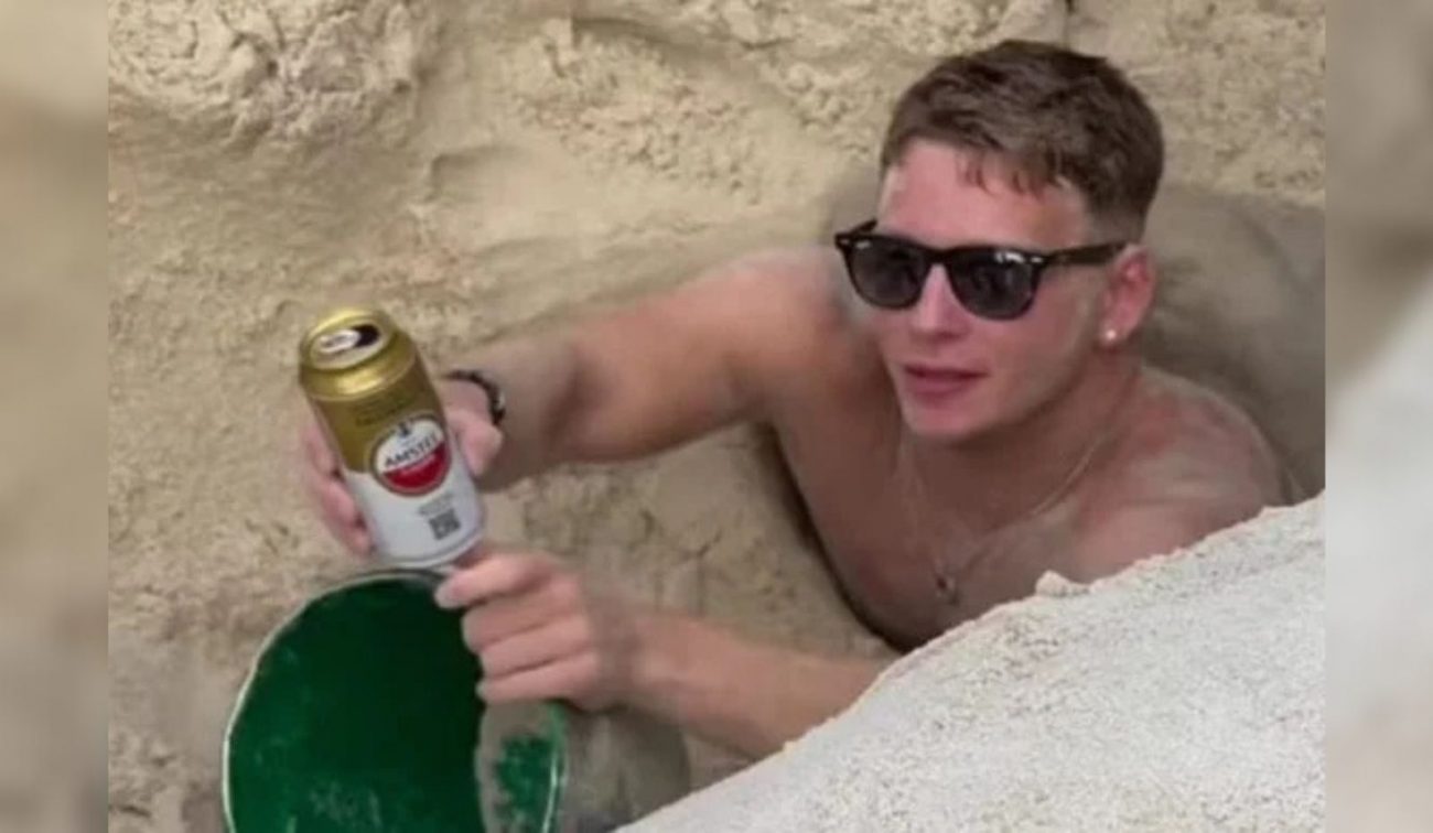 turista ficou preso em buraco na praia