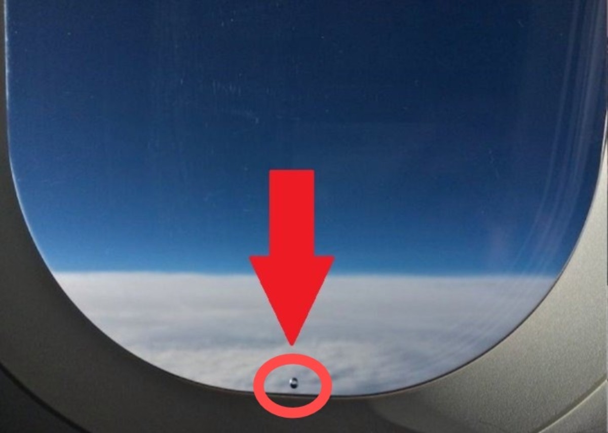 Furinho na janela do avião