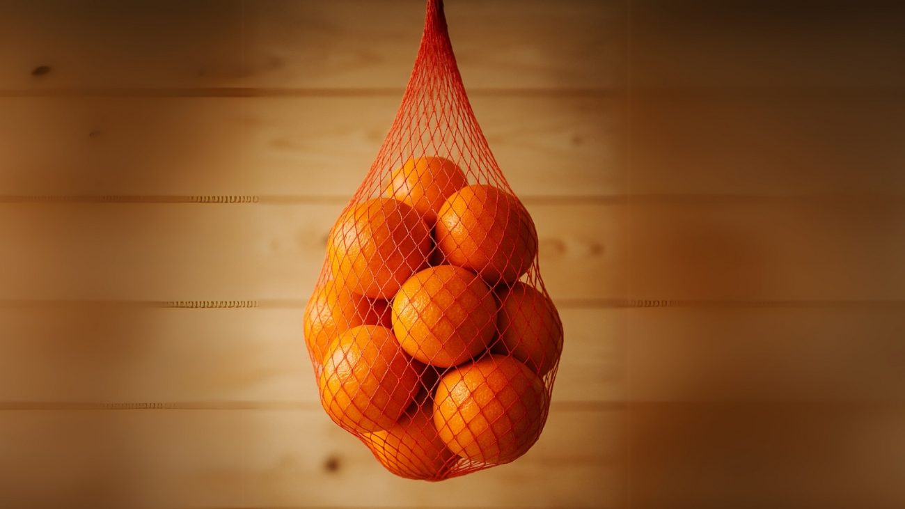 Imagem de laranja dentro de saco de malha