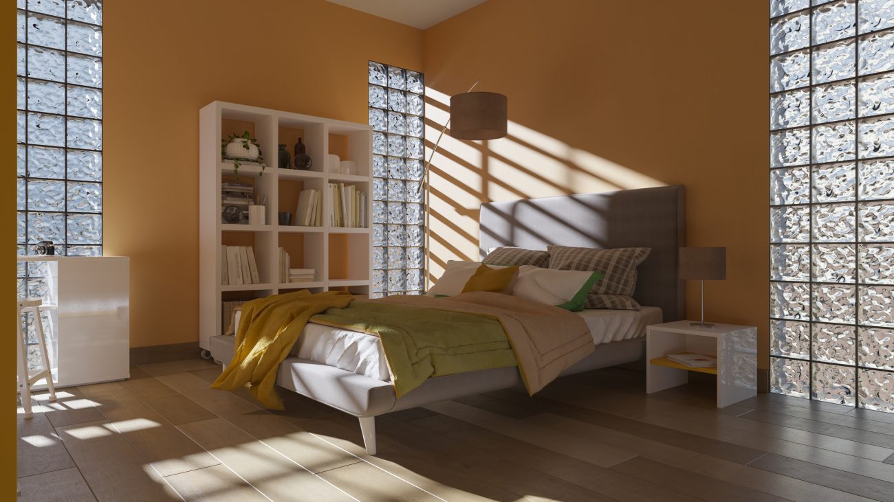 Quarto moderno com paredes laterais feitas de tijolo de vidro, permitindo a entrada de luz natural e criando um ambiente iluminado e aconchegante