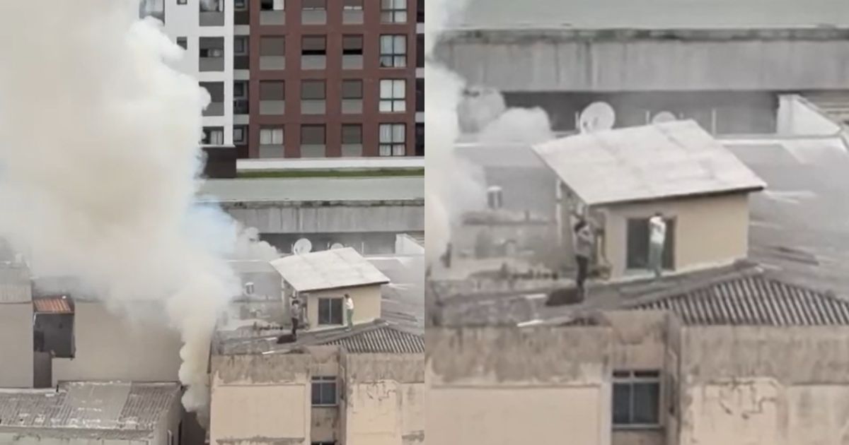 VÍDEO: Prédio é evacuado e duas pessoas são resgatadas pelo terraço durante incêndio em SC